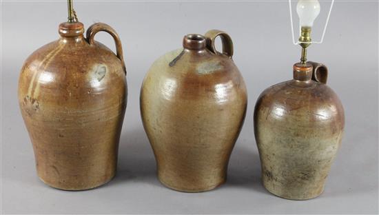 Three saltglaze stoneware flagons, tallest 18in.